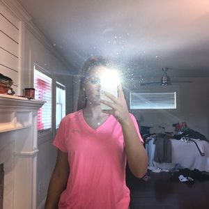 a pink athletic shirt